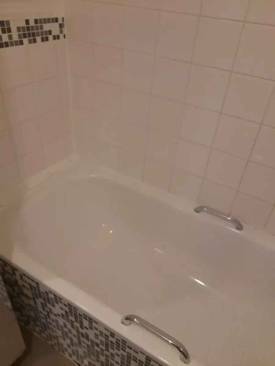 Bathtub and tile walls scrubbed bright