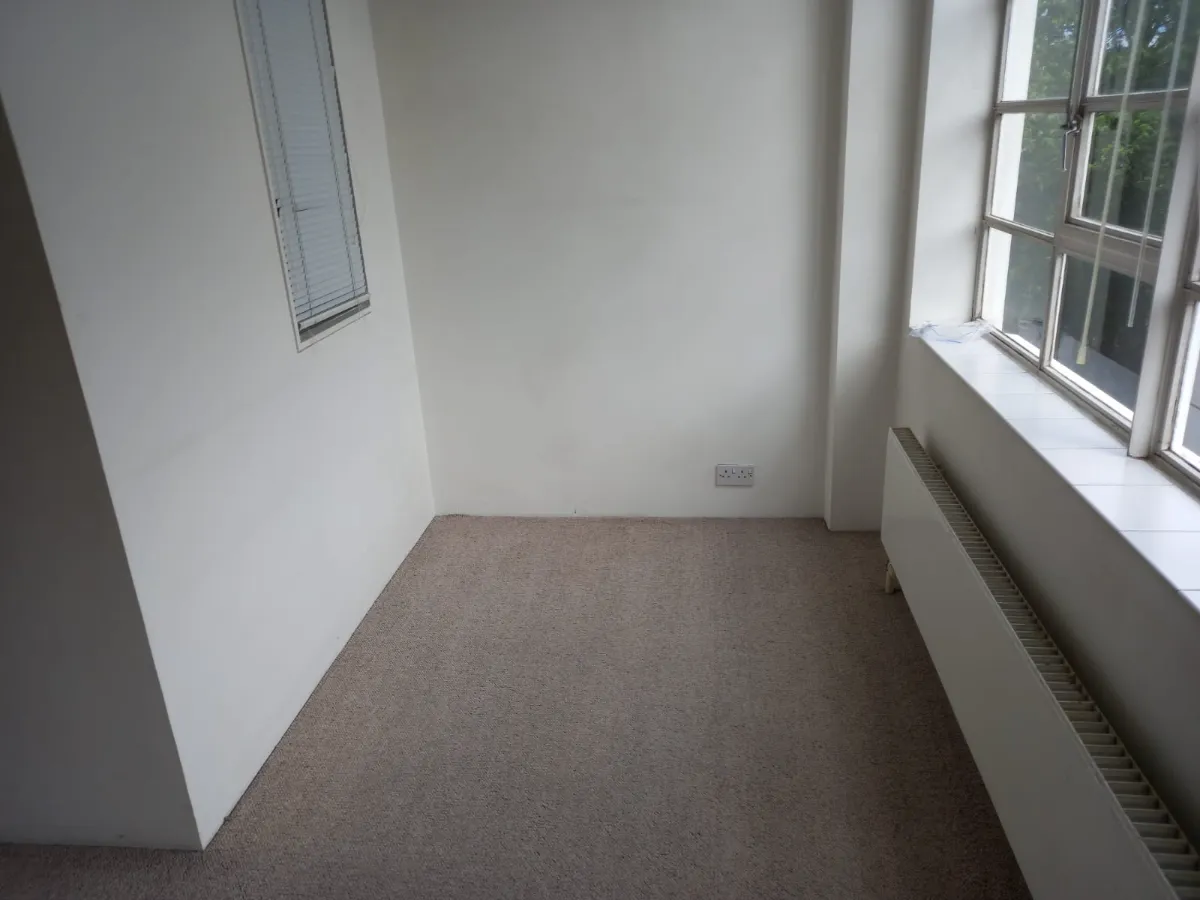 Empty room vacuumed and ready for move-in