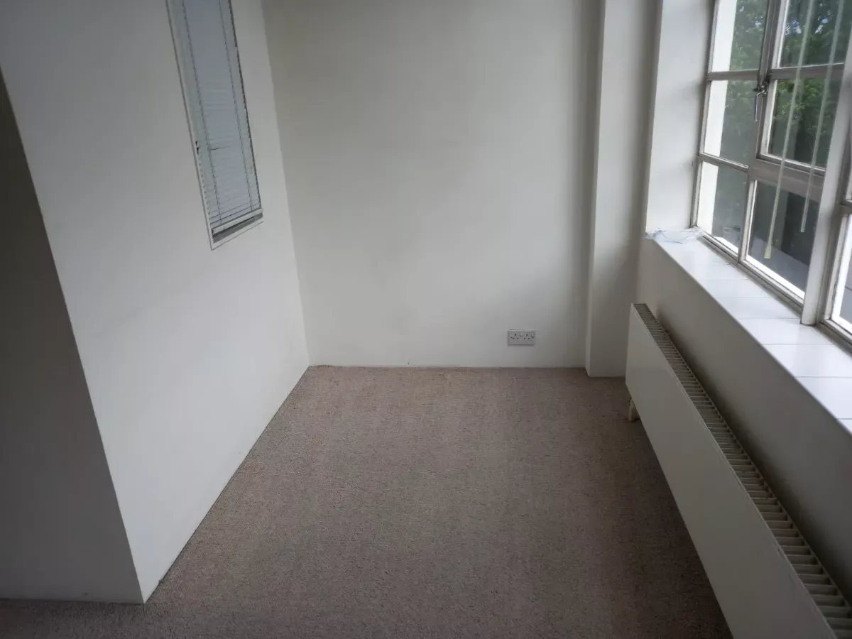 Empty room vacuumed and ready for move-in
