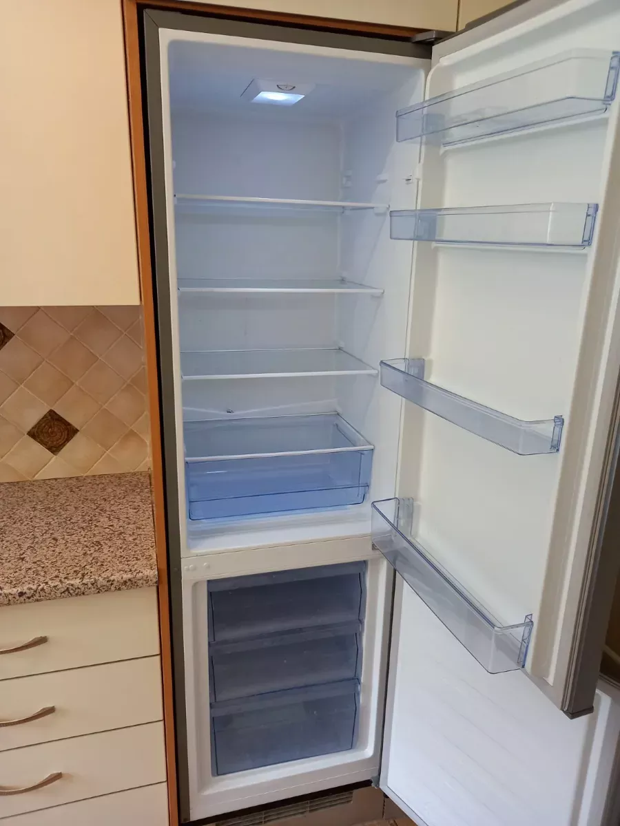 Fridge wiped clean, shelf by shelf