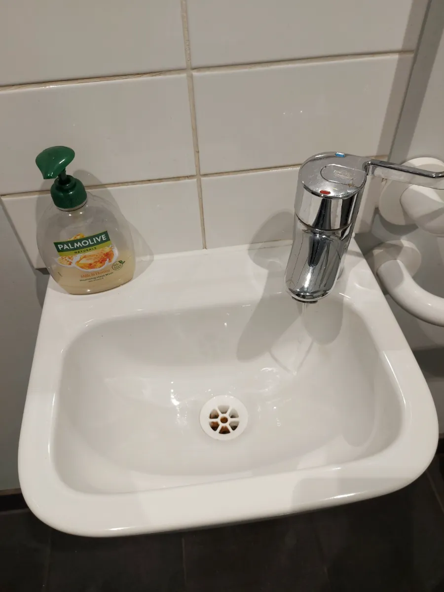 Hand sink and tiles left spotless