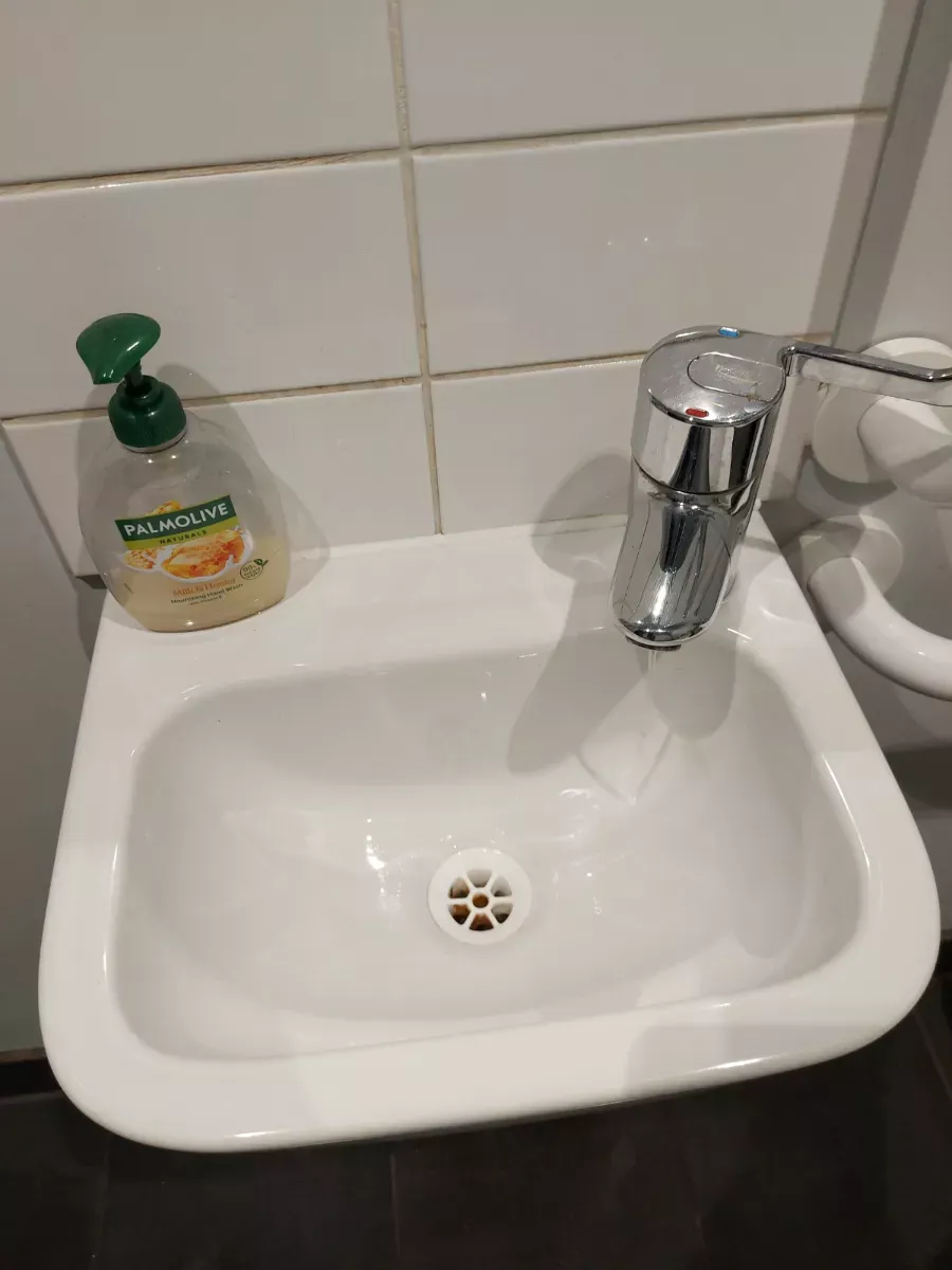 Hand sink and tiles left spotless